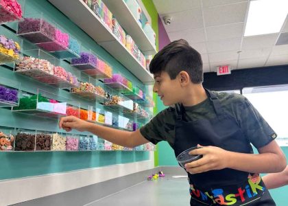 Premium DIY Slime Bar in Houston featuring over 100 colorful charms, scents, and textures for a custom slime museum experience.