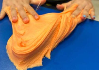 Kid making and playing with colorful slime at Funtastik Labs